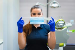 Dentist doctor holding medical mask