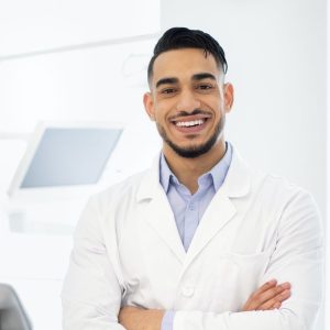 Portrait Of Smiling Dentist Doctor Posing